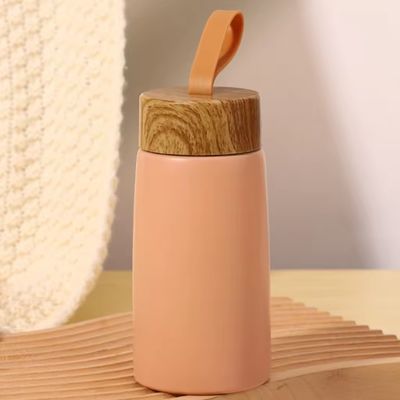 Vacuo 304 aço inoxidável garrafas de água isoladas 280ml portátil grãos de madeira criativos