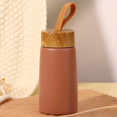 Vacuo 304 aço inoxidável garrafas de água isoladas 280ml portátil grãos de madeira criativos